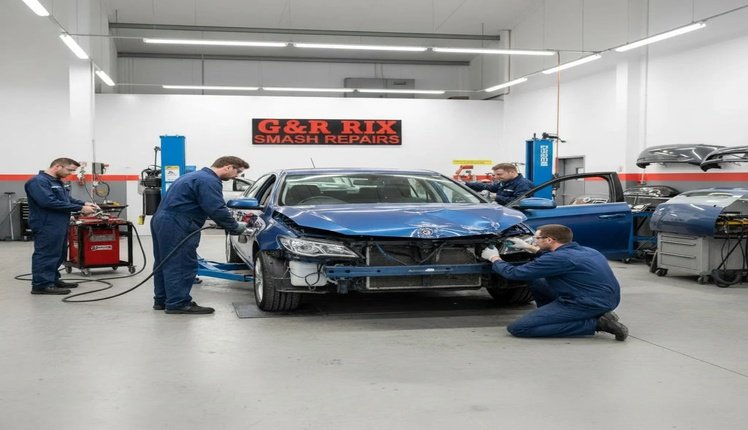 smash repair Technician inspecting vehicle damage during a smash repair at G&R Rix Smash Repairs